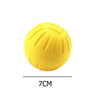 Bright yellow EVA pet ball dog toy with textured grooves and paw print details for interactive play. - Image 4