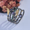 Anillo de Diamante Multicolor con Diseño de Hoja y Pluma