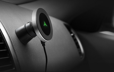 Silver and black car magnetic wireless charger with a blue indicator light, mounted on a car's air vent. - Image 7