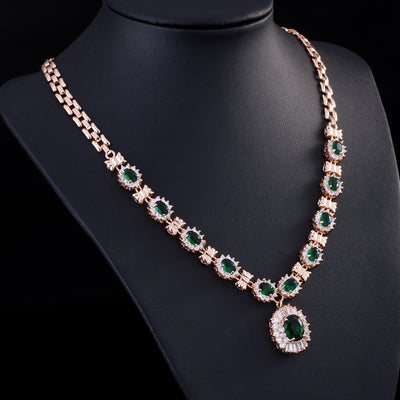 Rose gold tone jewelry set with oval blue gemstones and clear accents, including a necklace, bracelet, earrings, and ring. - Image 6