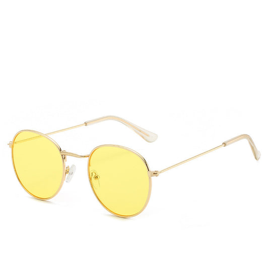 Round gold-framed sunglasses with pink tinted lenses, featuring clear temple tips. - Image 31