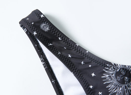 Black celestial print bikini set with a bandeau tie-front top and high-cut bottoms, featuring sun, moon, and star patterns. - Image 14