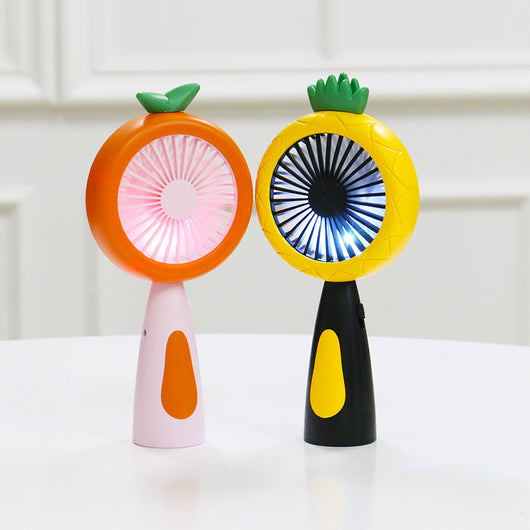 White and lime green children's handheld fan with a round head, small leaf accent, and fruit-like design.