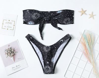 Black celestial print bikini set with a bandeau tie-front top and high-cut bottoms, featuring sun, moon, and star patterns. - Image 8