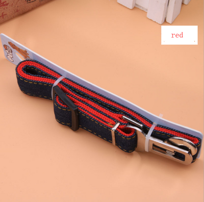 Dark blue denim pet car seat belt with yellow stitching, metal buckle, and plastic adjuster on a hanger. - Image 6