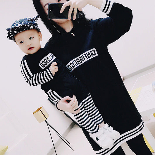 Black sweater suit with white stripes on sleeves and hem, featuring mirrored "SAN FRANCISCO" text on the chest. - Image 4