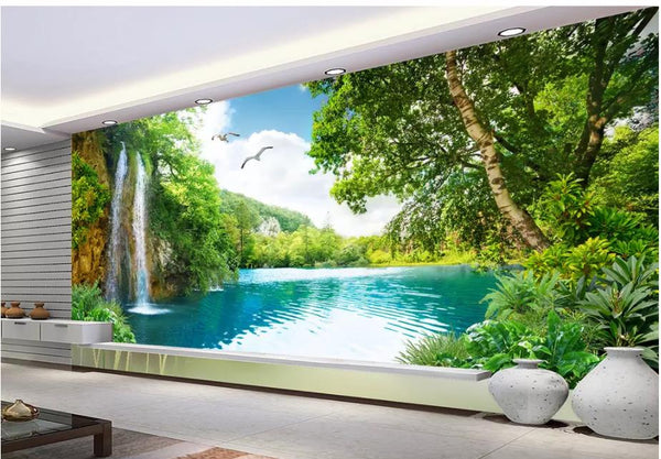 3D wallpaper mural depicting a vibrant landscape with a waterfall, blue lake, lush green trees, and flying birds.