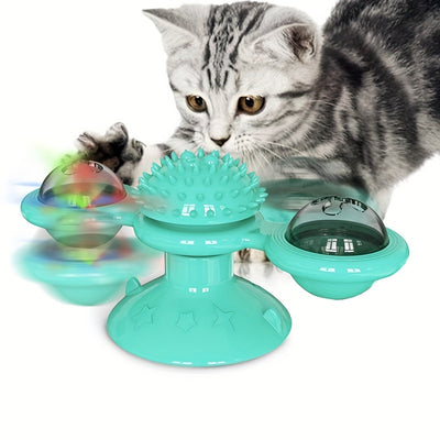 Gray tabby cat playing with a teal windmill cat toy featuring a suction cup base, textured ball, and colorful spinning paddles. - Image 7