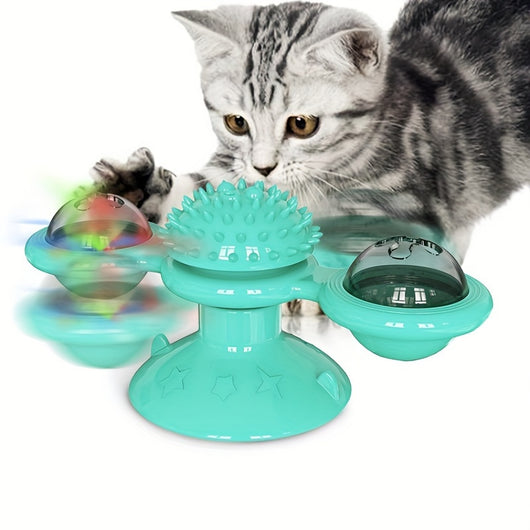 Gray tabby cat playing with a teal windmill cat toy featuring a suction cup base, textured ball, and colorful spinning paddles. - Image 7