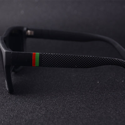 Men's grey plastic frame driving sunglasses with dark polarized lenses and red and black stripe detail on temples. - Image 3