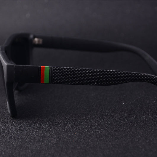 Men's grey plastic frame driving sunglasses with dark polarized lenses and red and black stripe detail on temples. - Image 3