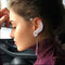 Aretes Asimétricos de Circón y Diamantes - Diseño Pluma Elegante