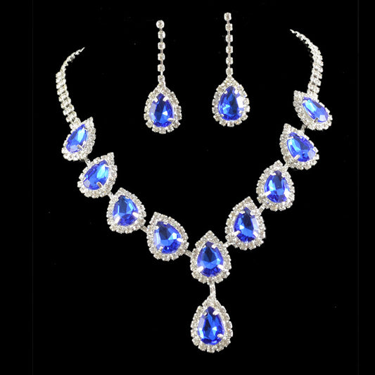 Bridal jewelry set with a silver-tone necklace and matching drop earrings, featuring orange teardrop rhinestones.