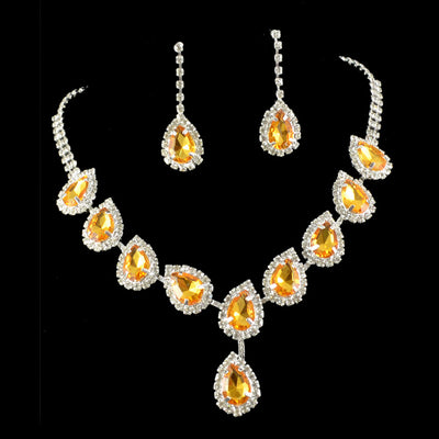 Bridal jewelry set with a silver-tone necklace and matching drop earrings, featuring orange teardrop rhinestones. - Image 4