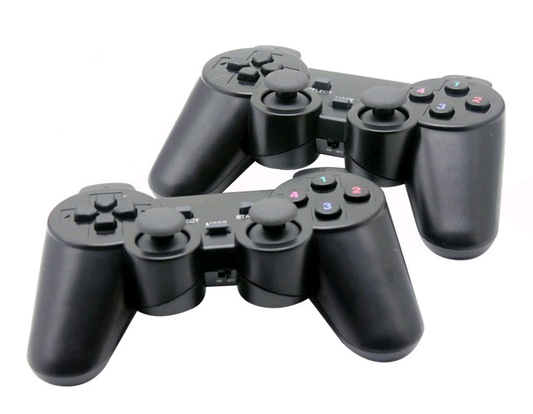 Black wireless game controller with dual analog sticks, D-pad, and colored face buttons, shown with its retail packaging and a USB dongle. - Image 2
