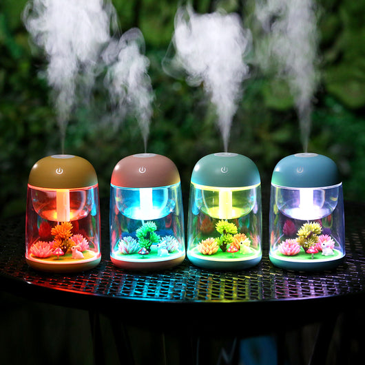 Pink and clear columnar humidifier with a micro landscape inside, featuring a white rabbit, red mushroom, and artificial plants. - Image 5
