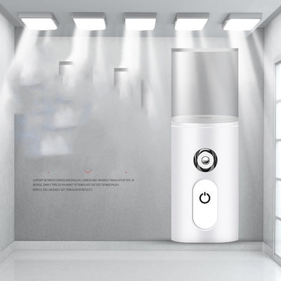 White portable facial humidifier with a clear water tank and a power button, for on-the-go moisturizing. - Image 2