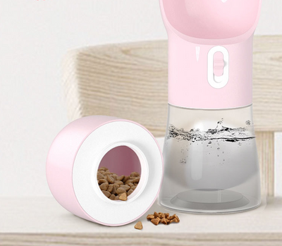 White and clear portable dog water dispenser with a built-in bowl and transparent water reservoir. - Image 4
