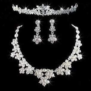 Silver-toned bridal tiara with clear rhinestones in a delicate floral and leaf design, perfect for weddings.