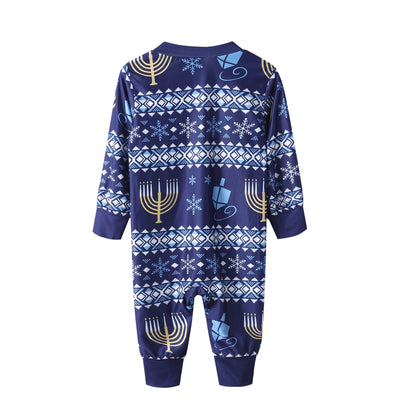 Family of five wearing matching navy blue Hanukkah pajamas with gold menorahs, blue dreidels, and white snowflakes. - Image 3