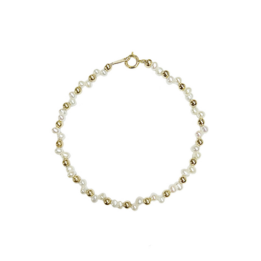 Pulsera Dorada con Bolsita Tejida de Perlas Naturales y Diseño Estelar