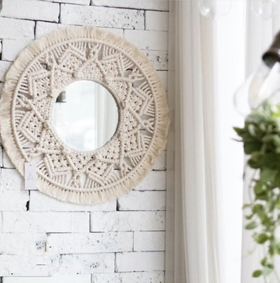 Circular mirror with a beige macrame fringe border, featuring intricate knotwork around the reflective surface. - Image 6