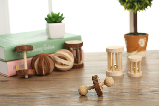 Set of natural wooden hamster toys including dumbbell shapes, a spherical bell toy, and two cylindrical bell toys, with a hamster. - Image 17