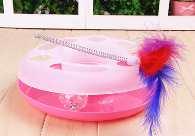 Interactive cat toy with a yellow and white circular ball track base and a spring-mounted feather wand. - Image 4