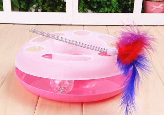 Interactive cat toy with a yellow and white circular ball track base and a spring-mounted feather wand. - Image 4