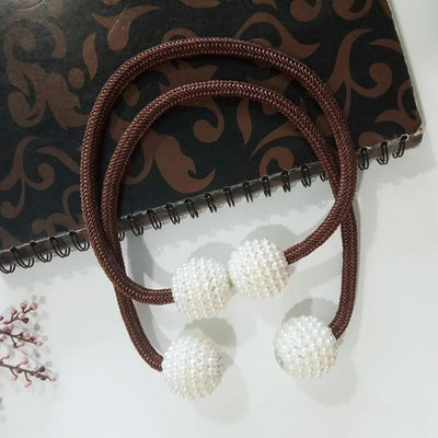 Magenta elastic curtain tieback with two white pearl-beaded spheres, designed to hold curtains elegantly. - Image 9