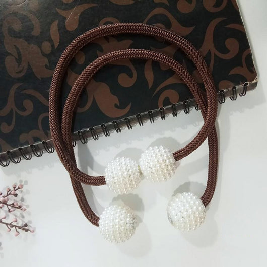Magenta elastic curtain tieback with two white pearl-beaded spheres, designed to hold curtains elegantly. - Image 9