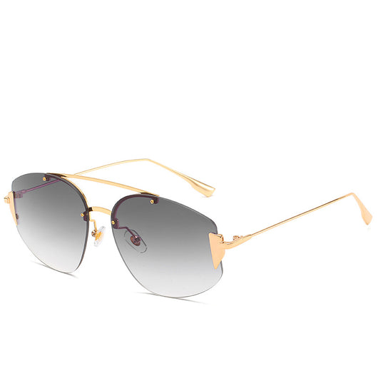 Women's fashion rimless sunglasses with blue to yellow gradient lenses and a gold-colored metal frame. - Image 3