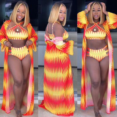 Women's blue and yellow geometric print bikini with high-waisted bottoms and a matching sheer kimono cover-up.