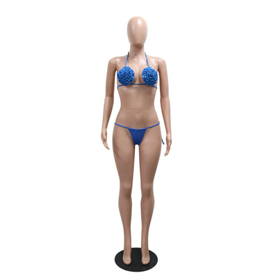 Blue three-piece bikini set with floral appliques on the triangle top, thong bottom, and matching ruched maxi skirt. - Image 13