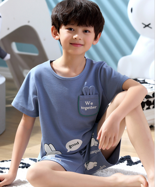 Family of four in matching light blue cotton short-sleeved pajamas with cartoon animal pocket design and 'SLEEP' text. - Image 5