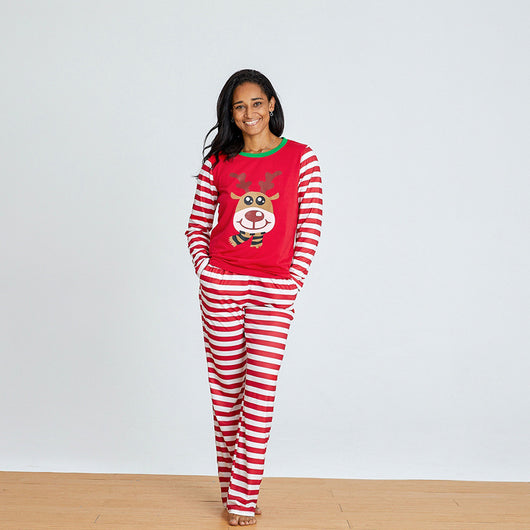 Young boy wearing a red and white striped long-sleeved pajama set with a reindeer graphic on the chest. - Image 13