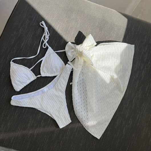 White textured bikini with ruched triangle top, high-cut bottom, and matching sarong with a large bow. - Image 28