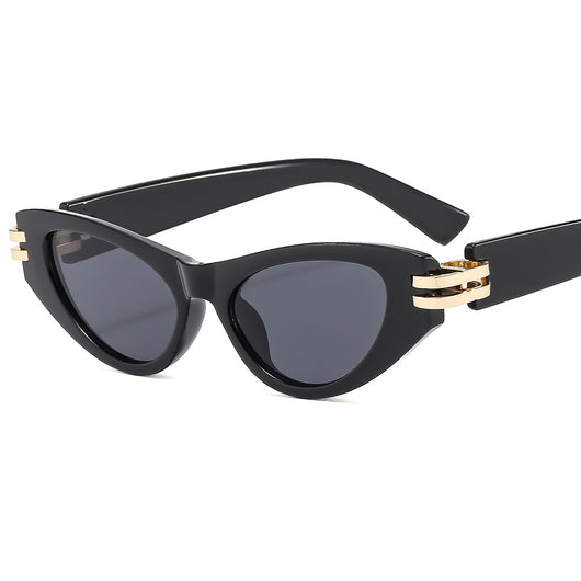 Black cat-eye sunglasses with dark gray lenses and gold-tone hinge accents on a white background. - Image 2