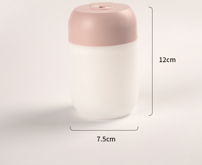 White cylindrical mini humidifier with a soft yellow glow, suitable for air moisturizing and aromatherapy, USB powered. - Image 7