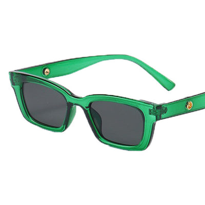 Transparent gray frame sunglasses with dark gray rectangular lenses and small gold accents on the temples. - Image 21