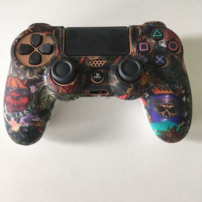 Blue silicone protective sleeve for PS4 Slim Pro controller with a vibrant graphic pattern of skulls and skeletons. - Image 24