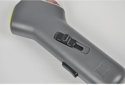 Dog Treat Launcher in retail packaging, a gray handheld device for dispensing snacks during training or playtime. - Image 5