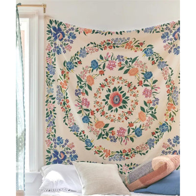 Artistic style tapestry with a vibrant floral pattern featuring a central flower and concentric rings of red, blue, orange, and pink blossoms on a light pink ba - Image 3