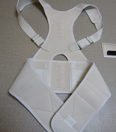 Beige magnetic posture correction belt worn on a woman's back over a black top, showing shoulder and waist support. - Image 10