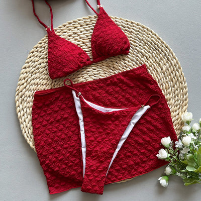 Red textured three-piece women's swimsuit set with triangle bikini top, thong bottom, and matching mini skirt. - Image 3