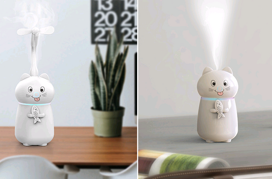 White cartoon cat humidifier with a pink tongue, black eyes, and whiskers, holding a fish skeleton, with a glowing blue light band. - Image 4
