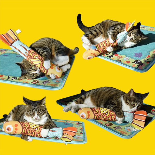 Colorful fish-shaped cat toy with a pink head, green body, and striped tail, featuring a vibrant abstract pattern.