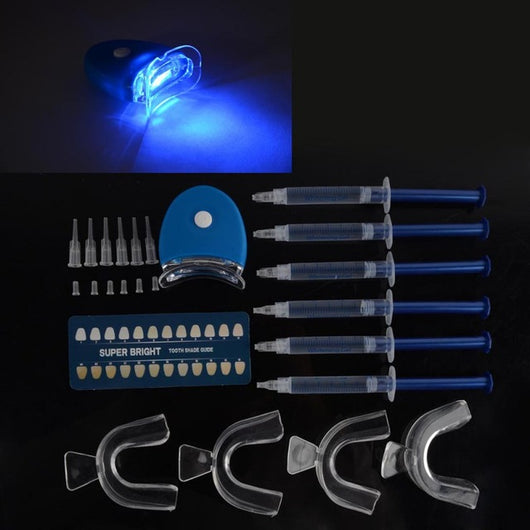 Teeth whitening kit with a blue LED light mouthpiece and a syringe of whitening gel on a white background. - Image 8