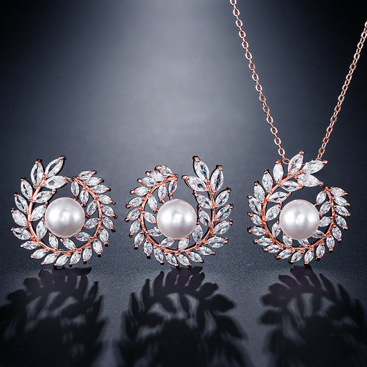 Elegant pearl and cubic zirconia jewelry set with a necklace and two earrings, featuring a wreath design. - Image 12