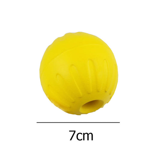 Bright yellow EVA pet ball dog toy with textured grooves and paw print details for interactive play. - Image 9